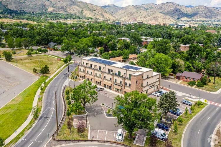 Arial view of building at 615 24th St, mountains in background